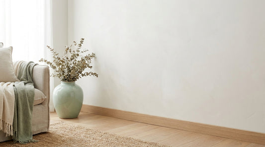 A clean bright contemporary Australian wall, skirting and floor corner in soft natural light, minimal calm and fresh.