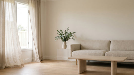 An airy, fresh Australian living room with an open window and light linen curtains